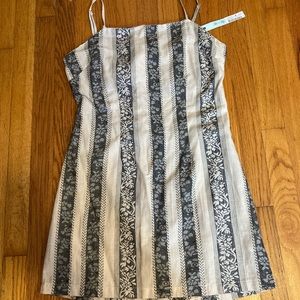 She and sky, large striped floral dress